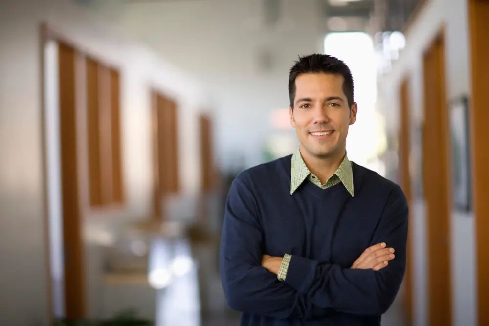 Businessman standing in hallway of office