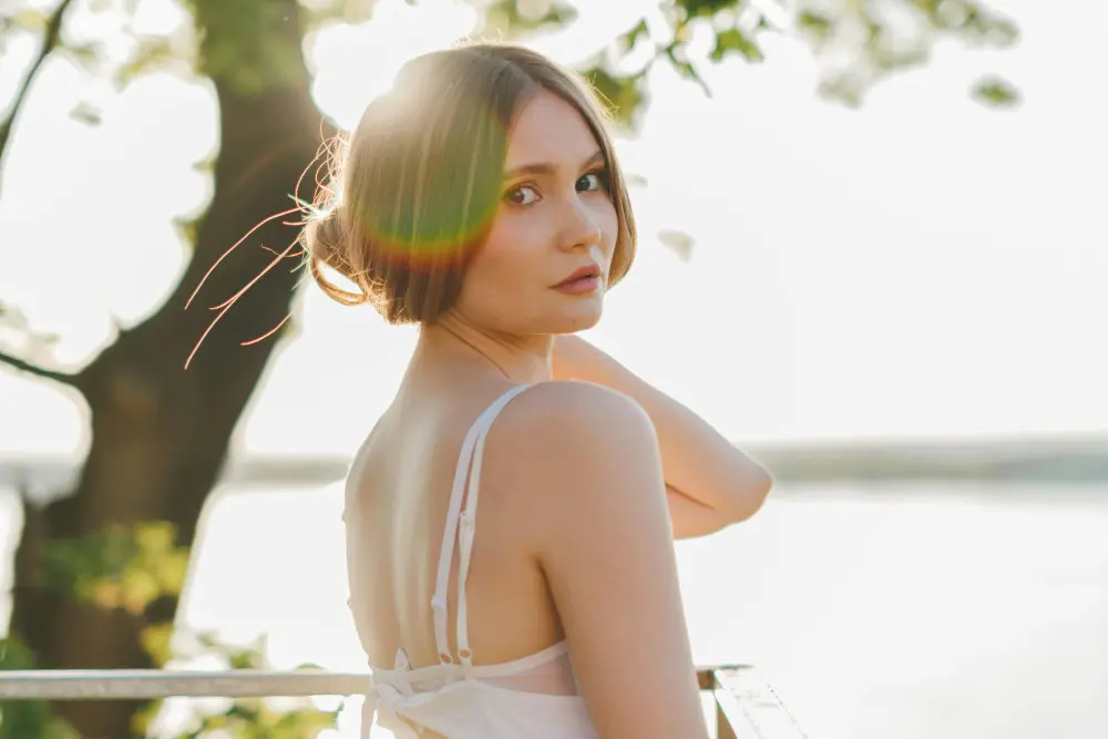 woman at lake in white