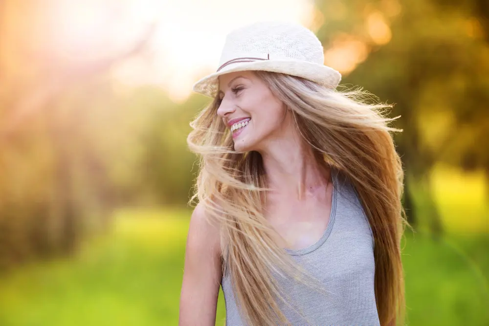 smiling woman in hat