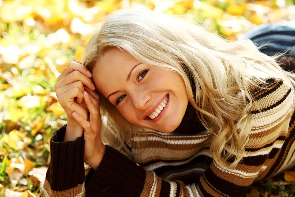 woman lying in leaves