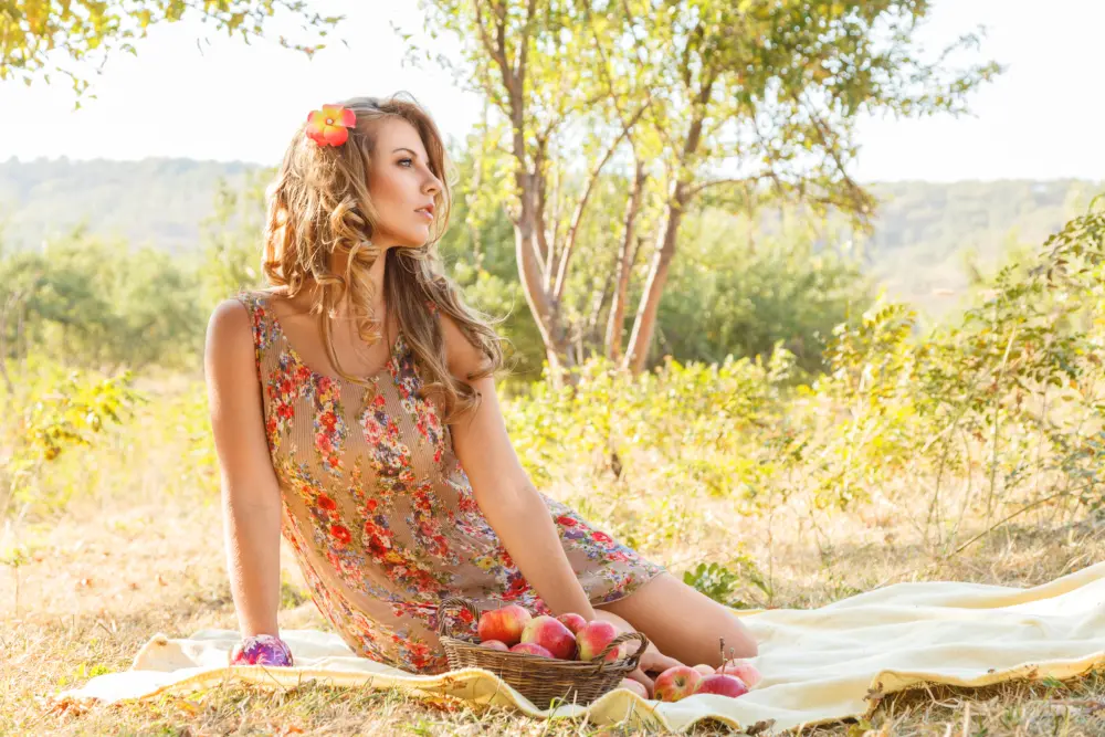 woman posing on a picnic blanket