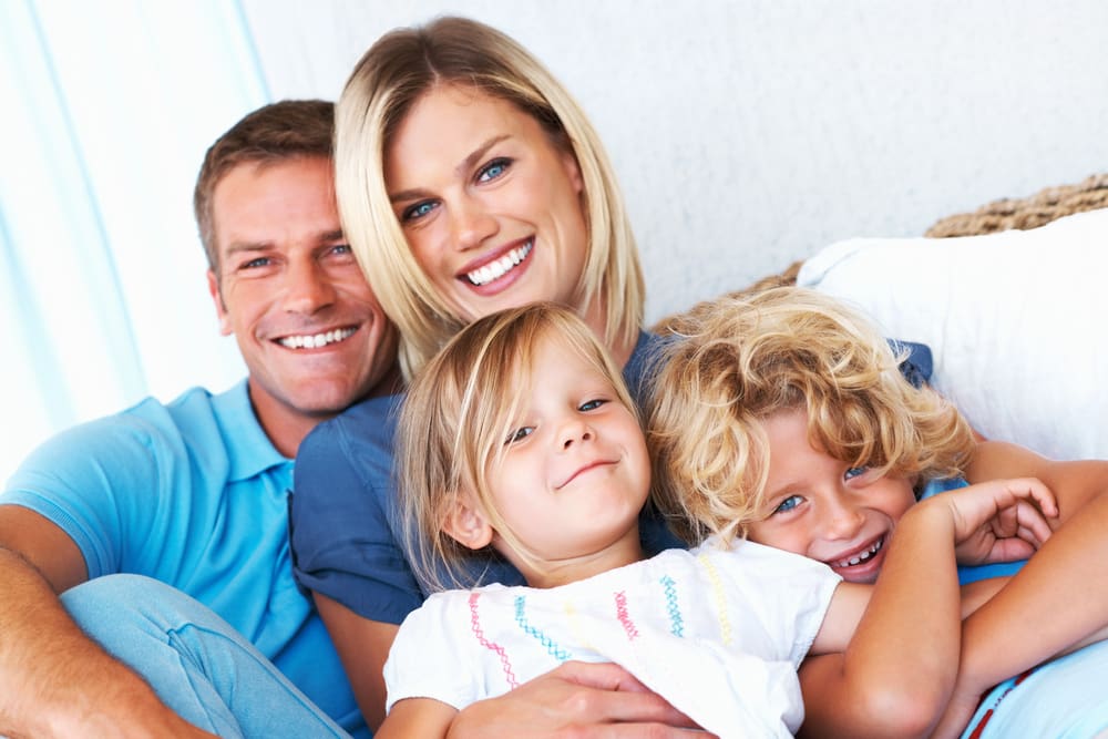 family on white couch