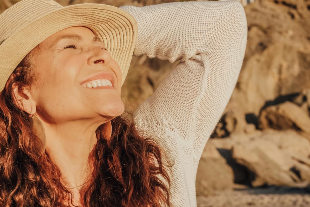 smiling woman in sunhat