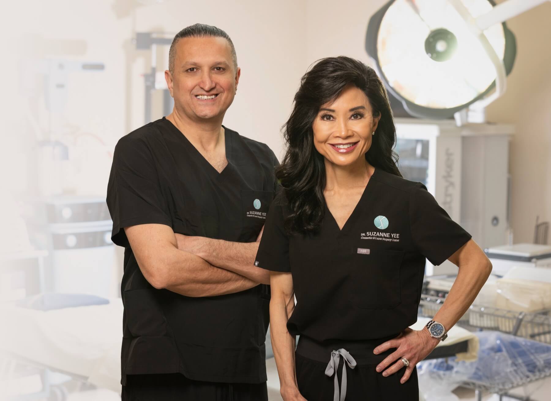 Dr. Suzanne Yee and Dr. Homayoun Pournik in surgical scrubs at Dr. Yee Cosmetic & Laser Surgery Center
